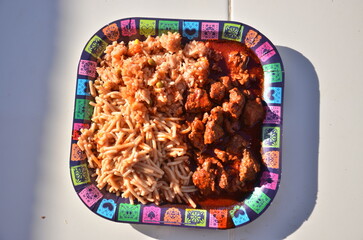 Authentic fiesta feast featuring delicious carne guisada, spaghetti, and rice, perfect for celebrating Dia de los Muertos with vibrant cultural flair