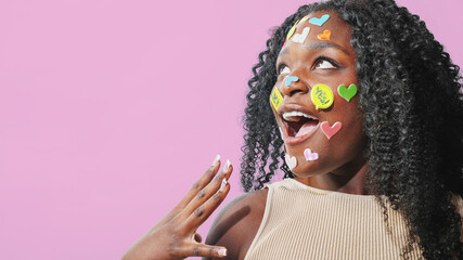  Portrait of carefree woman against pink background. social media addiction, communication concept.