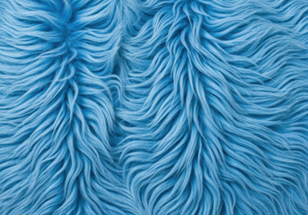 Fototapeta premium Soft blue faux fur fabric texture with long fluffy strands creating a cozy and warm surface pattern