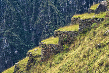 Close-up view with the ancient Inca stone walls and terraces  at Machu Picchu, Peru.
