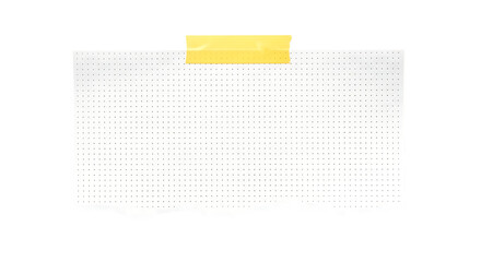Blank torn piece of dot grid paper held by a strip of yellow adhesive tape against a dark background