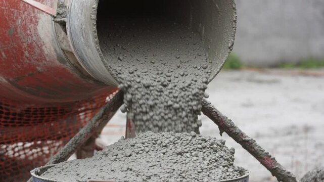 Wet concrete mixture pouring from cement mixer at construction site, industrial building foundation process, civil engineering infrastructure work, raw material flow texture, cement strength and durab