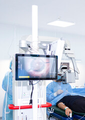 A doctor performs eye surgery in an operating room. Concepts of eye diseases, ophthalmology, vision health, vision diagnostics, and the medicine of the future.