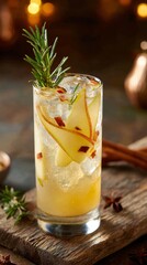 Fototapeta premium Spiced apple fizz, no alcohol, in highball glass — rosemary, cinnamon, pear slices on rustic wood.
