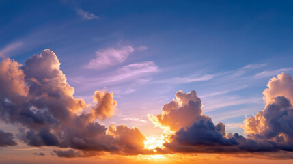 Stunning sunset sky with golden light shining through clouds