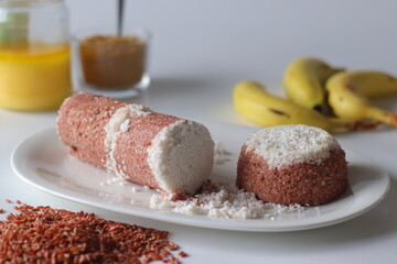 Navara rice puttu, steamed rice cake made with navara rice grains and grated coconut