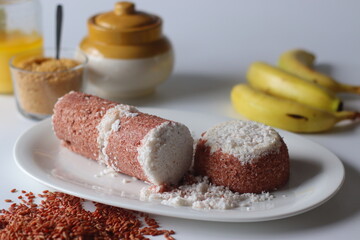 Navara rice puttu, steamed rice cake made with navara rice grains and grated coconut