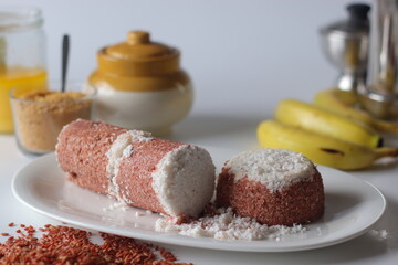 Navara rice puttu, steamed rice cake made with navara rice grains and grated coconut