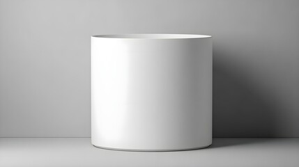Large white ceramic pot on grey background
