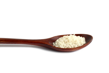  There is a wooden spoon with white rice on a white background.