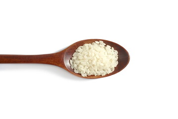There is a wooden spoon with white rice on a white background.	