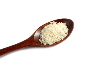 There is a wooden spoon with white rice on a white background.