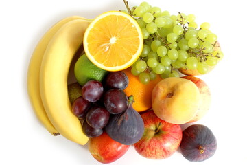  There are many different fresh bright fruits on a white background.