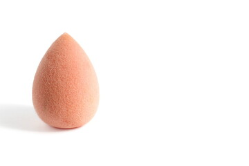 There is a makeup sponge on a white background.