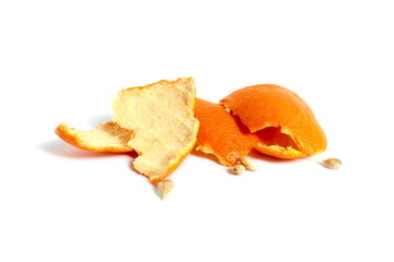 There is a small pile of orange peels lying on a white background.