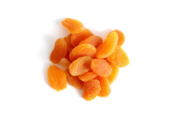 There is a small pile of dried apricots on a white background.