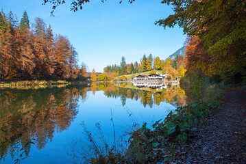 peaceful scenery lake Riessersee in autumn. hiking destination with restaurant