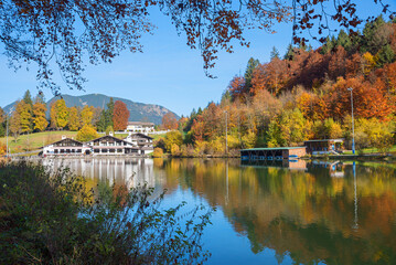 pictorial tourist destination with restaurant, lake Riessersee in autumn