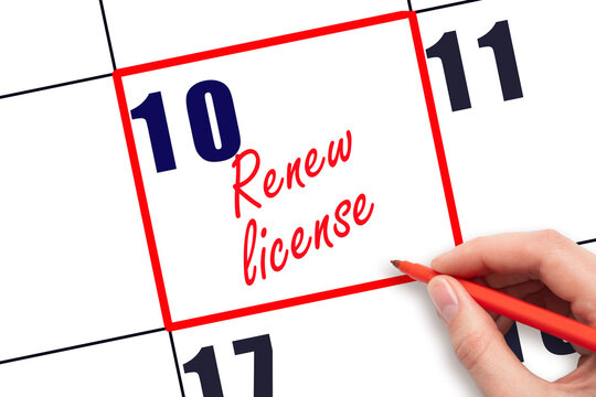 10 th day of the month.  Hand writing Renew license reminder and drawing red frame on calendar with red pen on white background. Business concept. Planning and scheduling