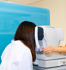 Doctor diagnoses eye diseases using modern ophthalmological equipment. Concepts of eye diseases, ophthalmology, vision health, vision diagnostics, medicine of the future.