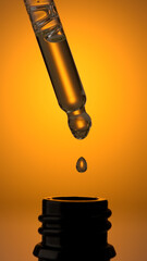 Close up view of Cosmetic oil dripping from pipette in a small bottle.