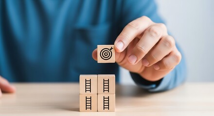 Person Placing Target Block on Top of Ladder Blocks Symbolizing Goal Achievement