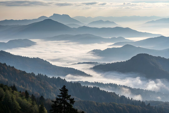 Layered mountain ranges fading into mist and fog at sunrise mountains layers