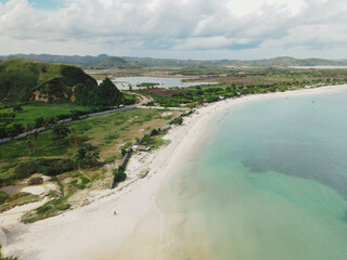 The coastal view is surrounded by enchanting green hills, including Merese Hill, which offers a spectacular viewpoint to enjoy the scenery. LOMBOK, NTB , INDONESIA