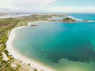 The coastal view is surrounded by enchanting green hills, including Merese Hill, which offers a spectacular viewpoint to enjoy the scenery. LOMBOK, NTB , INDONESIA