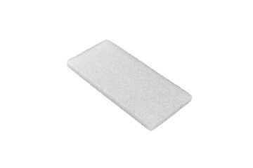 White rectangular foam block is isolated.