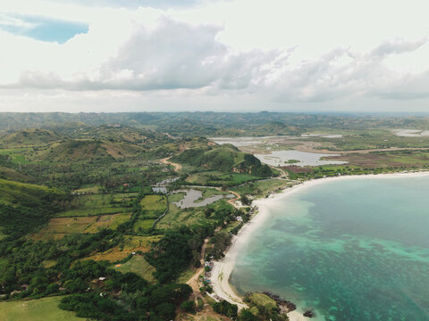 The coastal view is surrounded by enchanting green hills, including Merese Hill, which offers a spectacular viewpoint to enjoy the scenery. LOMBOK, NTB , INDONESIA