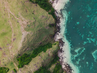 The coastal view is surrounded by enchanting green hills, including Merese Hill, which offers a spectacular viewpoint to enjoy the scenery. LOMBOK, NTB , INDONESIA