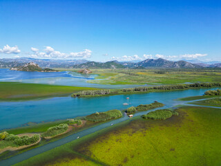Skadar lake river delta flowing into lush wetlands