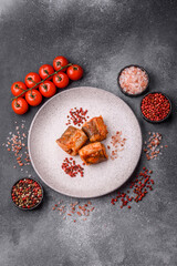 Hake fish cooked in pieces in tomato sauce, stew with peppers and carrots. Hake fish in tomato