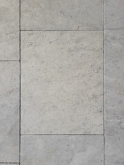 Light gray marble wall tiles texture.