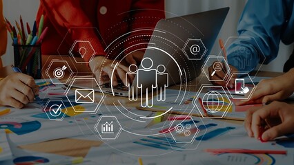 A diverse team collaborates in a vibrant workspace, brainstorming ideas while using modern technology and colorful charts, fostering innovation and productivity. Raster