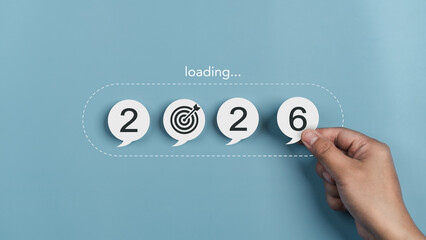 Goals 2026 concept, and goal setting for the new year. growth, readiness, and the journey toward achieving success and chance. progress loading bar and goal icon. Hand holding paper number six