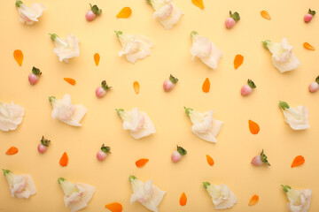 Floral pattern of flowers and roses, green leaves, branches on beige background. Flat layer, top view. Valentine's background. Floral pattern. Floral pattern. Floral pattern texture