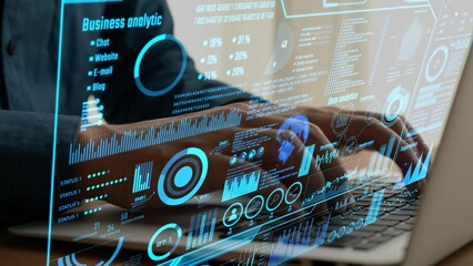 Dynamic scene with hands typing on a laptop, surrounded by interactive data visualizations highlighting business analytics for effective decision-making. Cipher