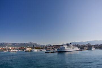 Scenic View of Ferry Ship in Harbor With Hills and Town in Background, Split, Croatia