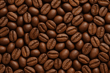 Obraz premium Macro Shot of Dark Roasted Coffee Bean Texture Background Representing Fresh Aroma and Quality Blend.