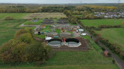 Aerial drone view of sewage treatment plant, removing contaminants from wastewater to provide drinking water and sanitation near Leicester, UK