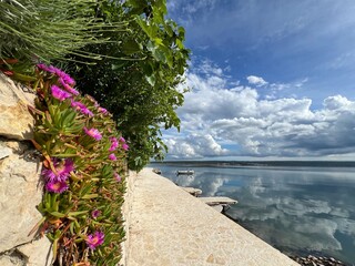 Promenade along the Adriatic Sea and beach in the Dalmatian tourist resort of Maslenica (Zadar, Croatia) - &Scaron;etnica uz Jadransko more i plaža u turističkom dalmatinskom naselju Maslenica (Hrvatska)