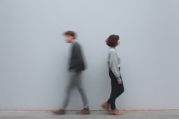 Blurred Paths: A poignant visual narrates a tale of introspection, featuring two individuals drifting away from each other, symbolizing the complexities of personal journeys and emotional detachment.