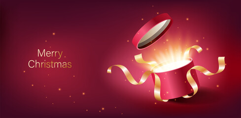 Red opened 3d realistic gift box with magical shining glow and golden ribbons flying off cover, place for your text vector illustration.