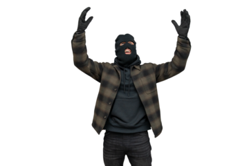 Thief wearing a balaclava raising hands in surrender, criminal caught, robber with hands up showing defeat