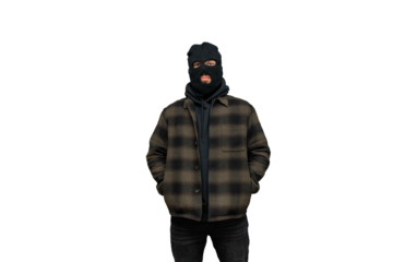 Criminal man wearing a balaclava, standing, looking directly, hands in pockets, isolated with cutting path