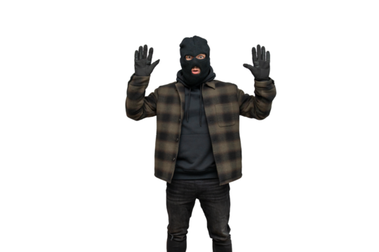 Robber wearing balaclava surrendering with hands up, caught burglar raising arms crime concept on transparent background