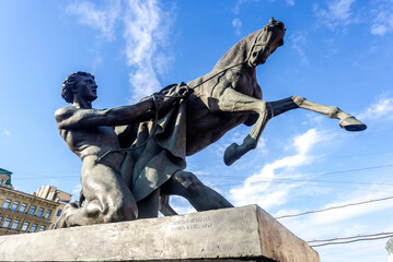 Horse Tamers sculpture designed by the Baron Peter Klodt.  Anichkov bridge, St. Petersburg, Russia,...