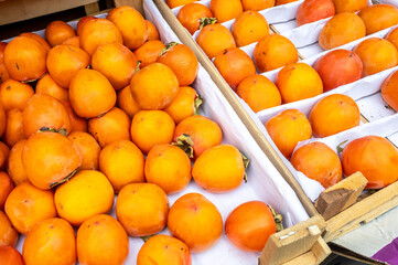 Organic ripe persimmon ready for sale at the farmers market